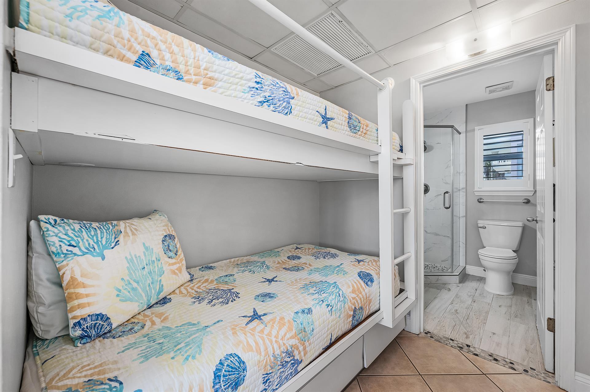 69 Crystal Beach Drive, Unit 8 Destin, FL 32541 - Photo 36 of 51 a bedroom with a bed and a toilet