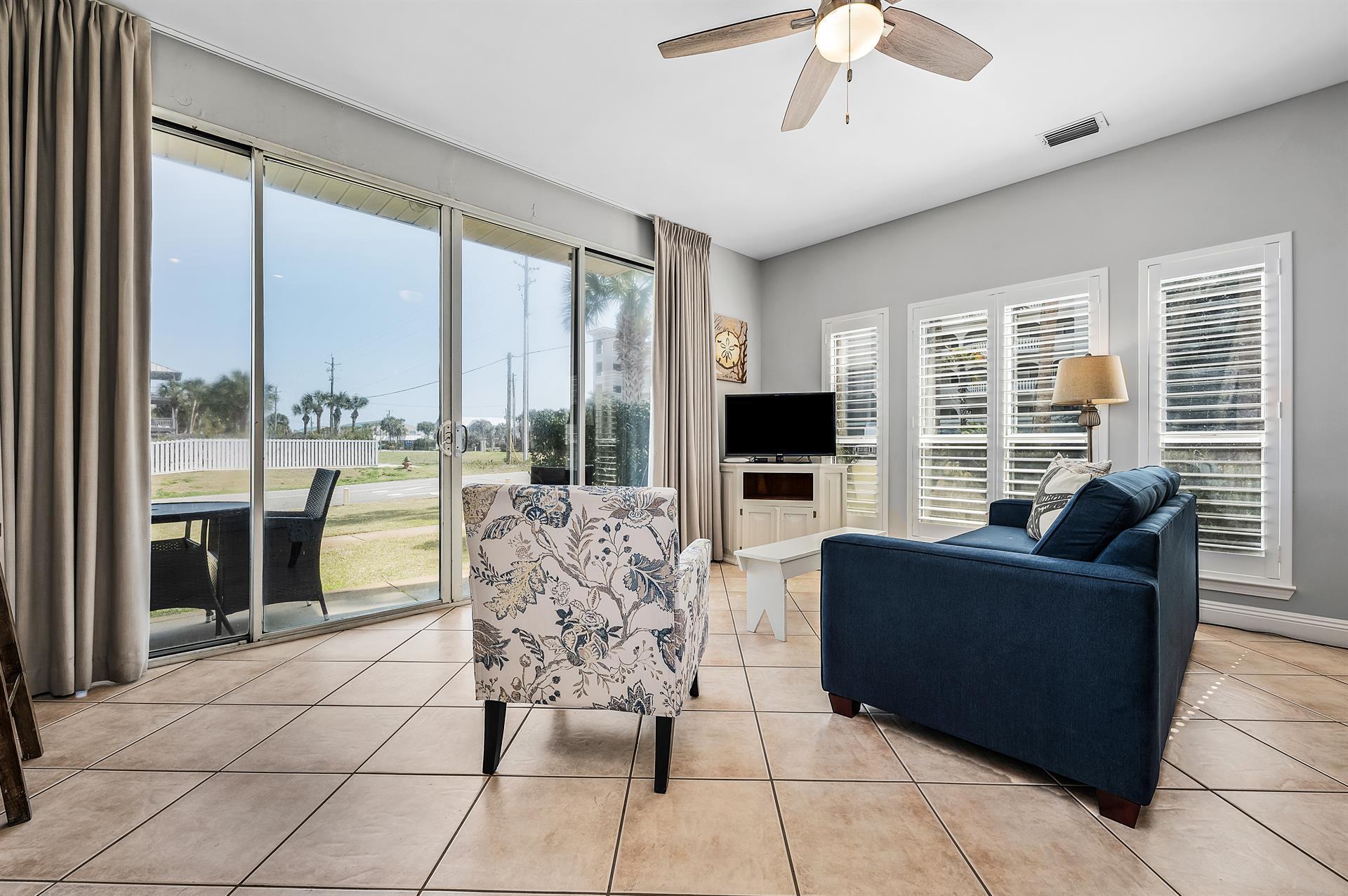 69 Crystal Beach Drive, Unit 8 Destin, FL 32541 - Photo 40 of 51 a living room with furniture and large windows