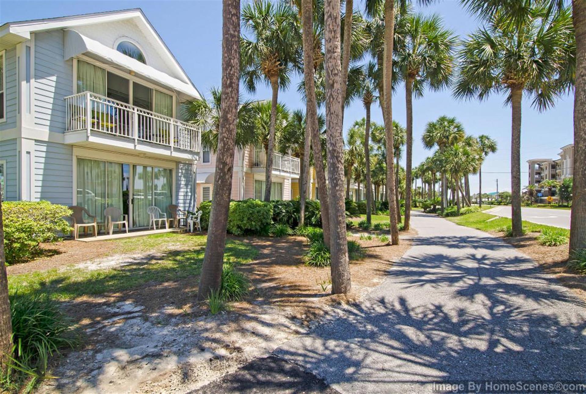 69 Crystal Beach Drive, Unit 8 Destin, FL 32541 - Photo 4 of 51 a view of a house with backyard and swimming pool