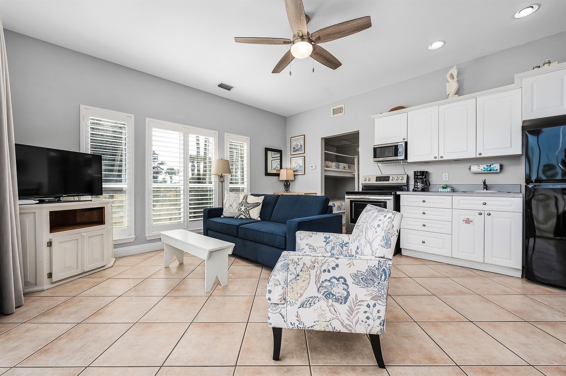 69 Crystal Beach Drive, Unit 8 Destin, FL 32541 - Photo 44 of 51 a living room with furniture and a flat screen tv