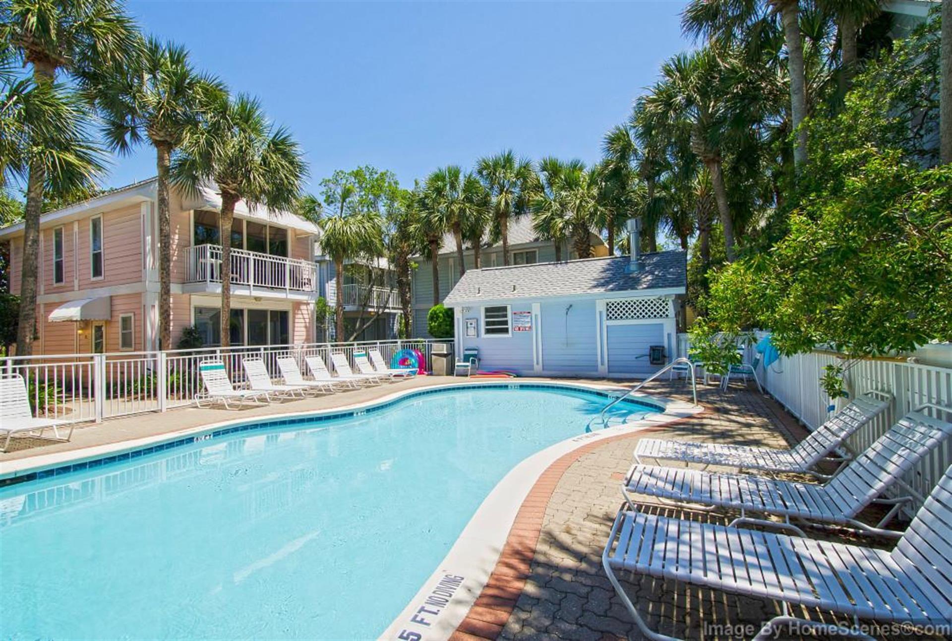 69 Crystal Beach Drive, Unit 8 Destin, FL 32541 - Photo 47 of 51 a view of a house with backyard and sitting area