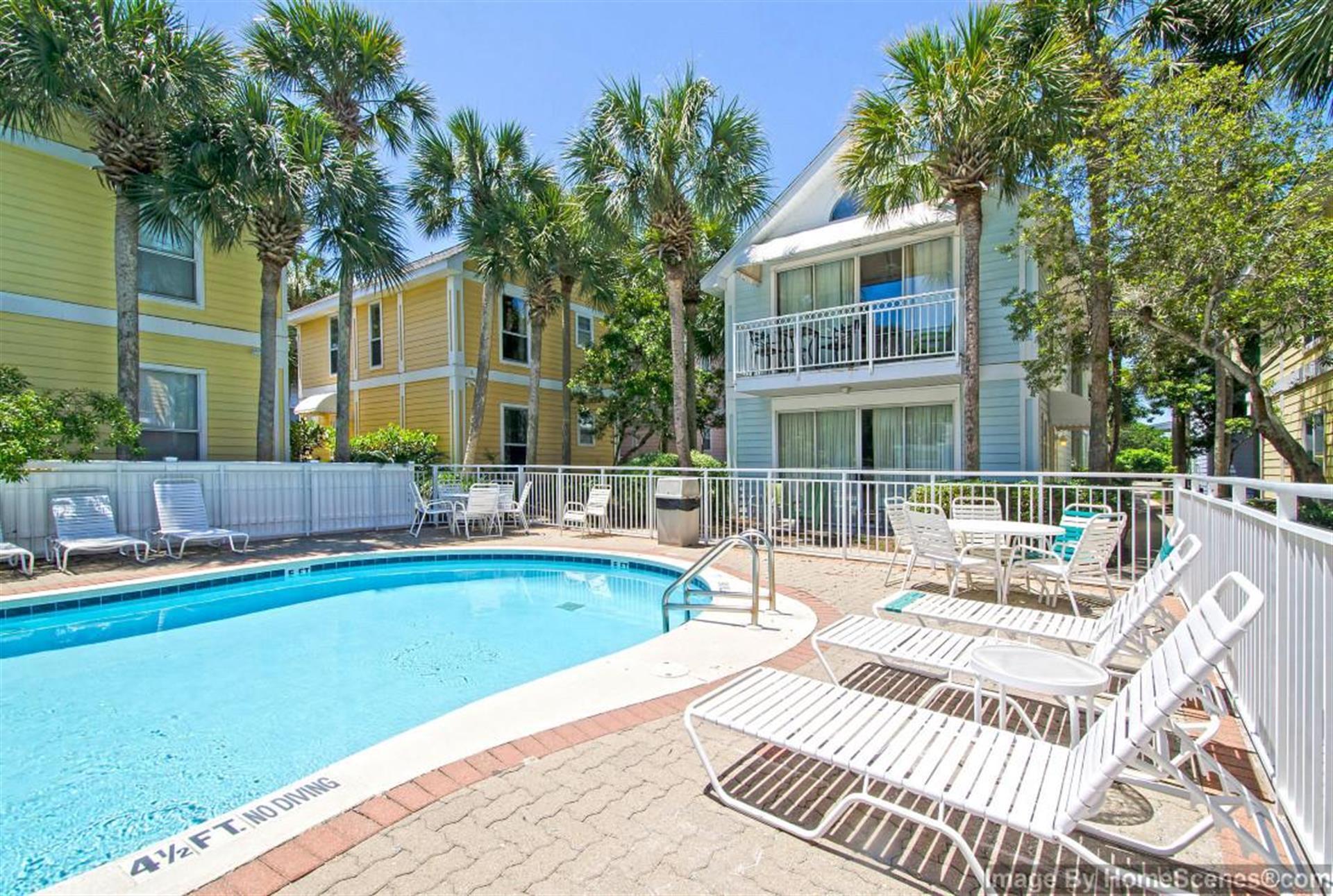 69 Crystal Beach Drive, Unit 8 Destin, FL 32541 - Photo 49 of 51 a view of a house with swimming pool and sitting area