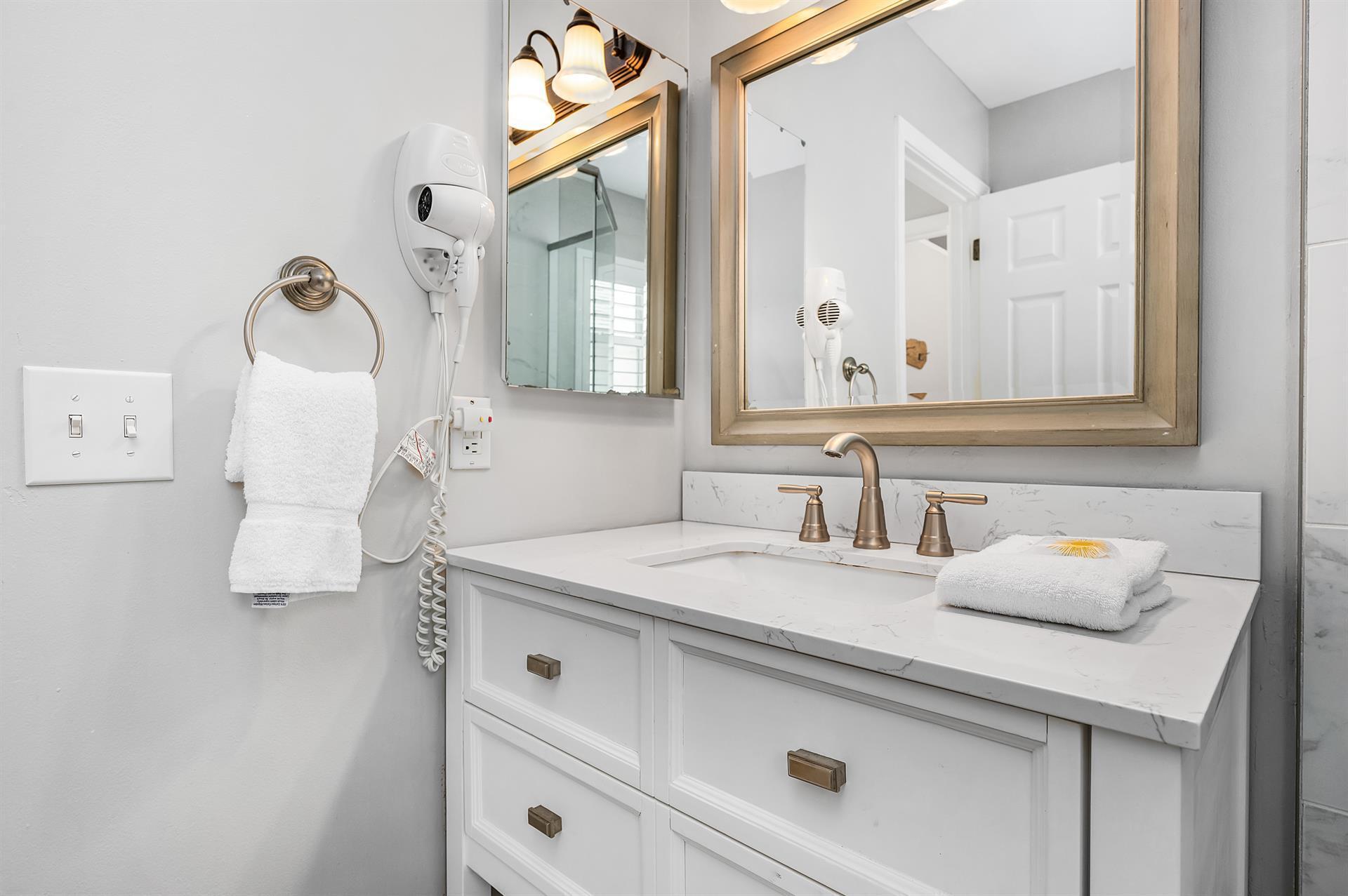 69 Crystal Beach Drive, Unit 8 Destin, FL 32541 - Photo 6 of 51 a bathroom with a sink and a mirror