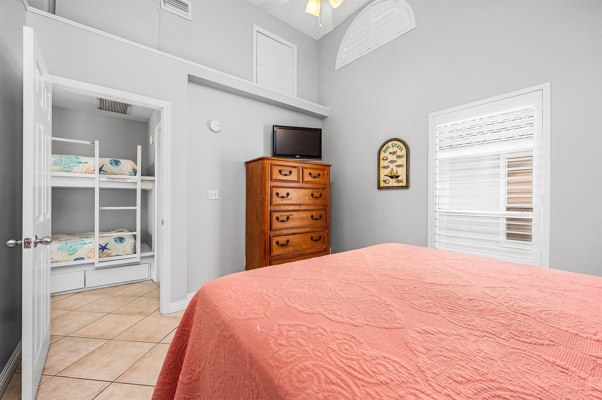 69 Crystal Beach Drive, Unit 8 Destin, FL 32541 - Photo 8 of 51 a bedroom with a bed and a cabinets