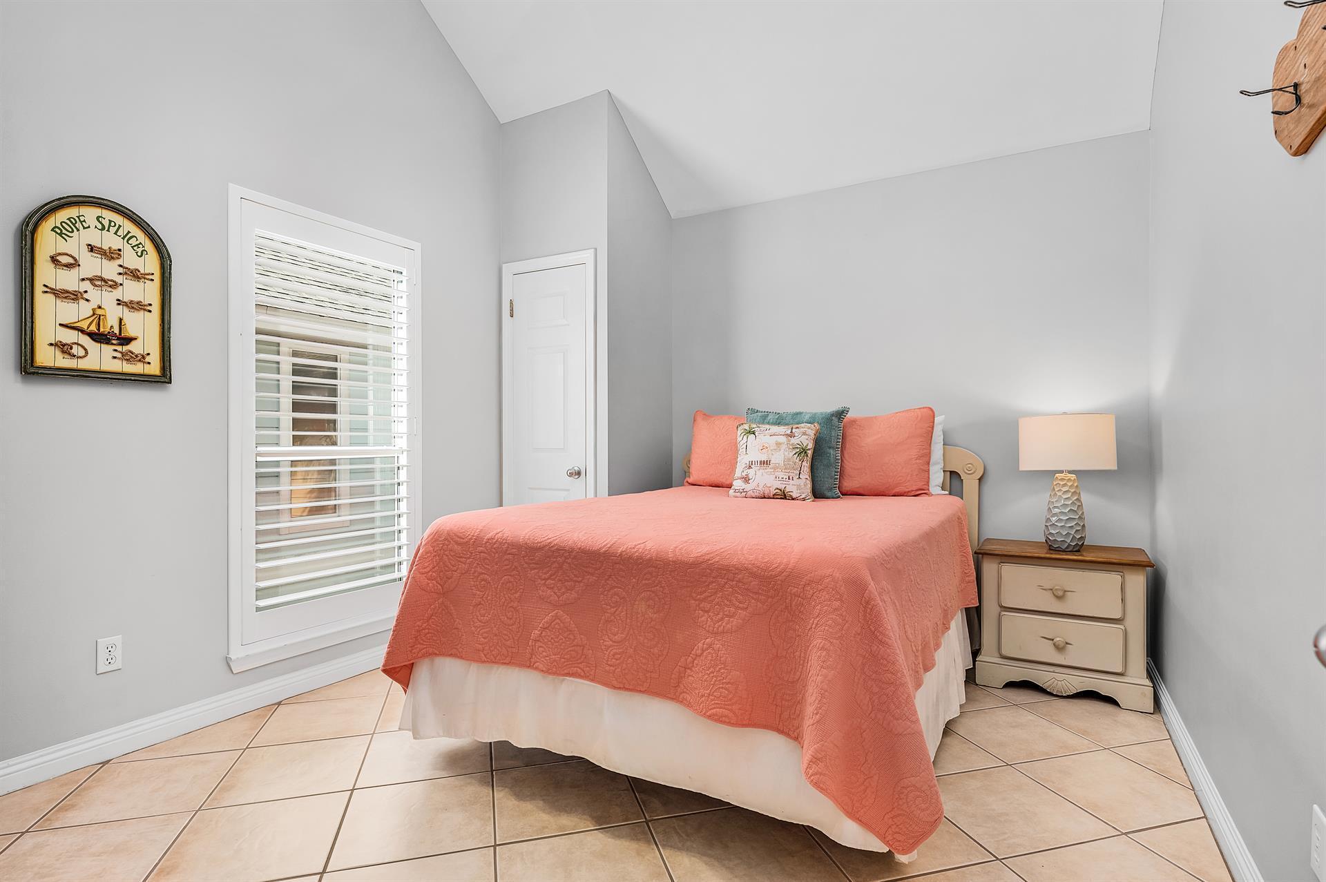 69 Crystal Beach Drive, Unit 8 Destin, FL 32541 - Photo 9 of 51 a bedroom with a bed and a window