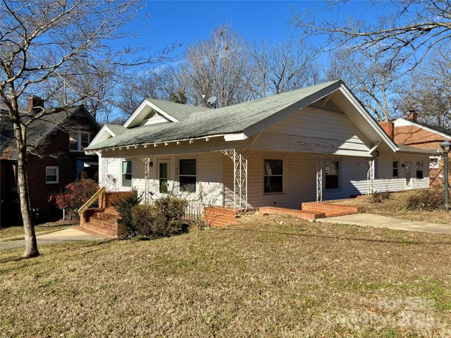 a backyard of a house with seating space