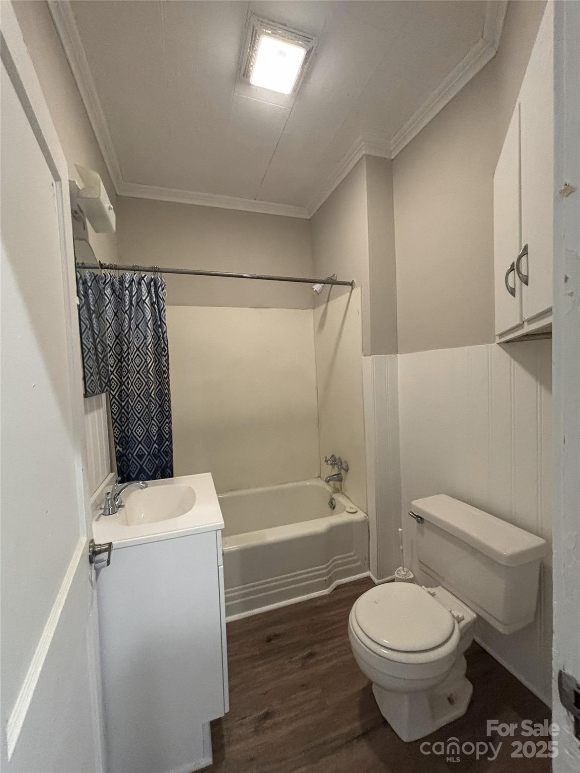 455 Spring Street Albemarle, NC 28001 - Photo 19 of 32 a bathroom with a toilet a sink and bathtub