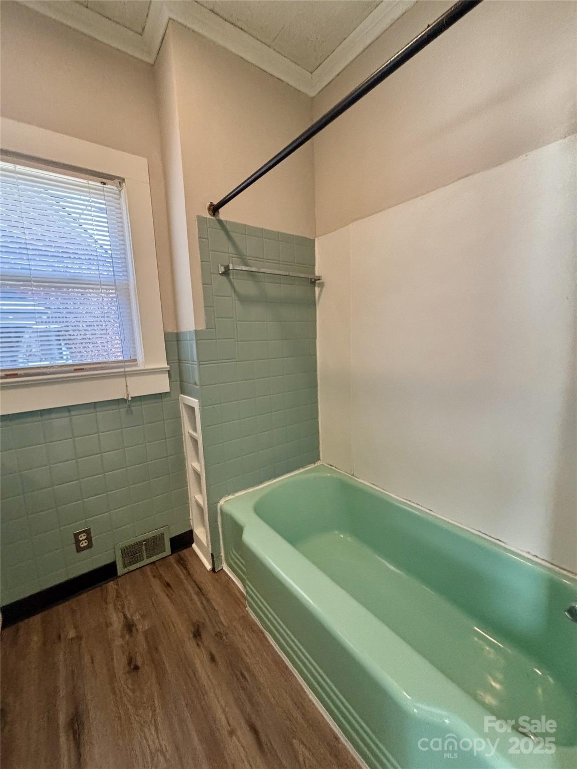 455 Spring Street Albemarle, NC 28001 - Photo 22 of 32 a bathroom with a bathtub and a shower