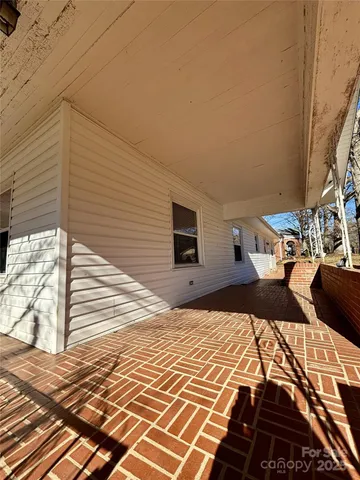 a balcony view with a bed