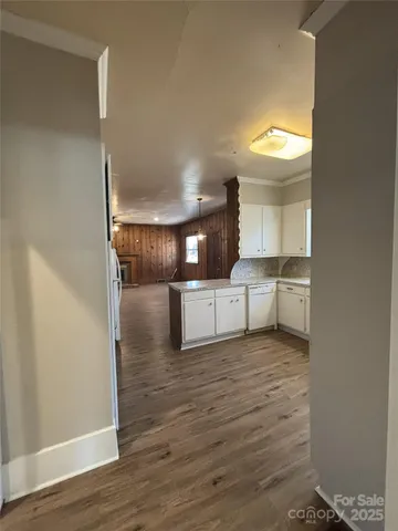a view of a kitchen with a sink and cabinets