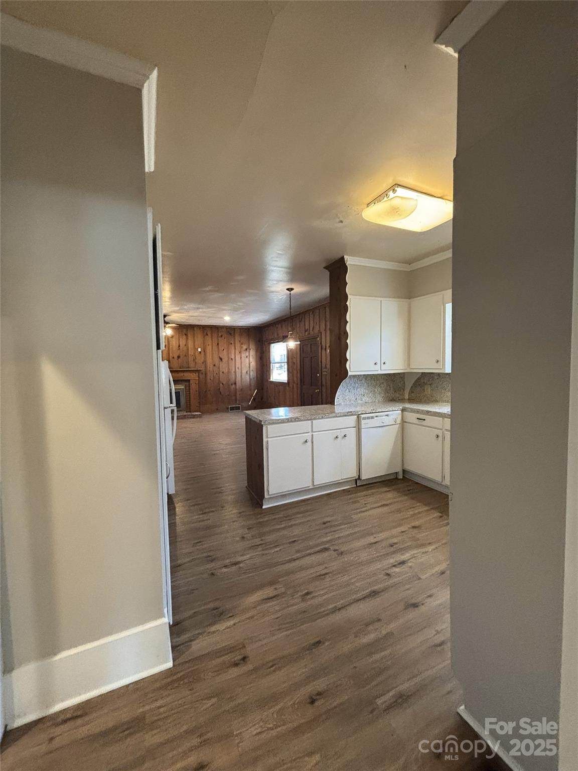 455 Spring Street Albemarle, NC 28001 - Photo 5 of 32 a view of a kitchen with a sink and cabinets