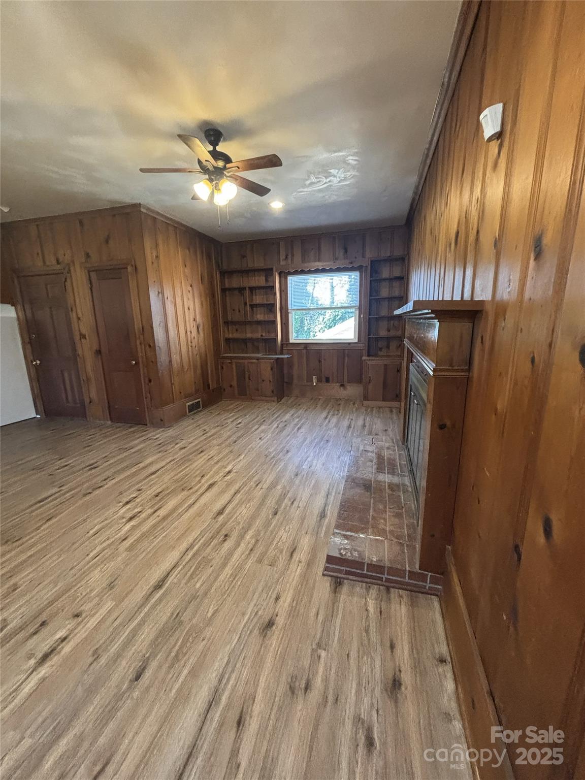 455 Spring Street Albemarle, NC 28001 - Photo 10 of 32 wooden floor in an empty room with a window
