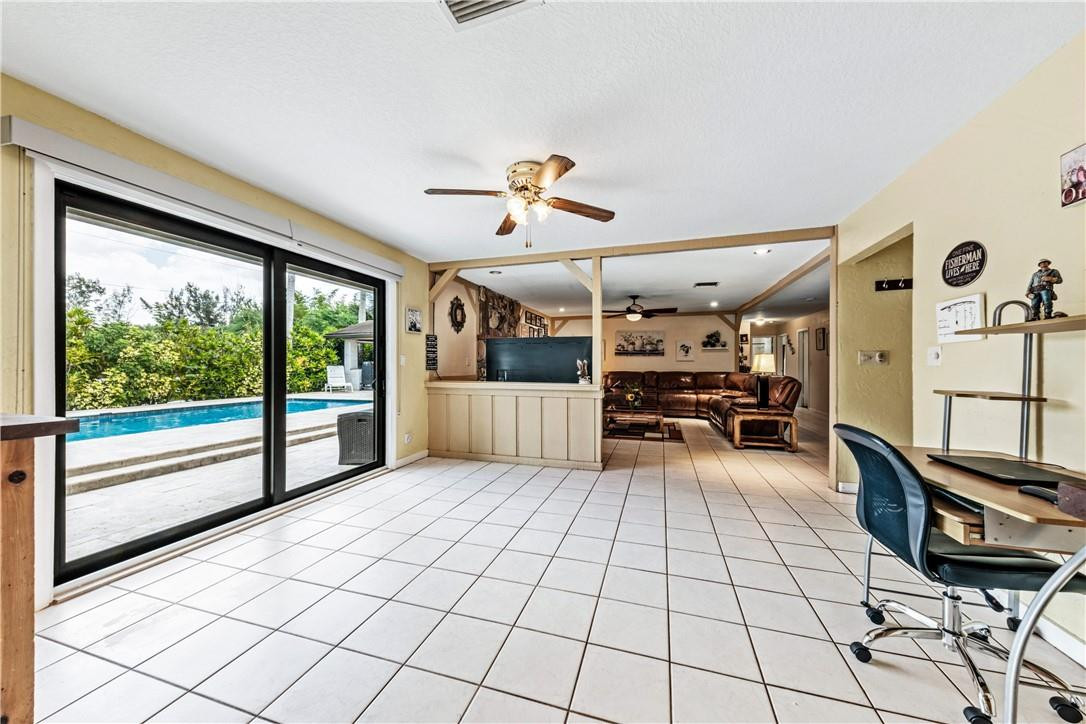 11301 Southwest 16th Street Davie, FL 33325 - Photo 13 of 54 a view of a living room and chandelier fan