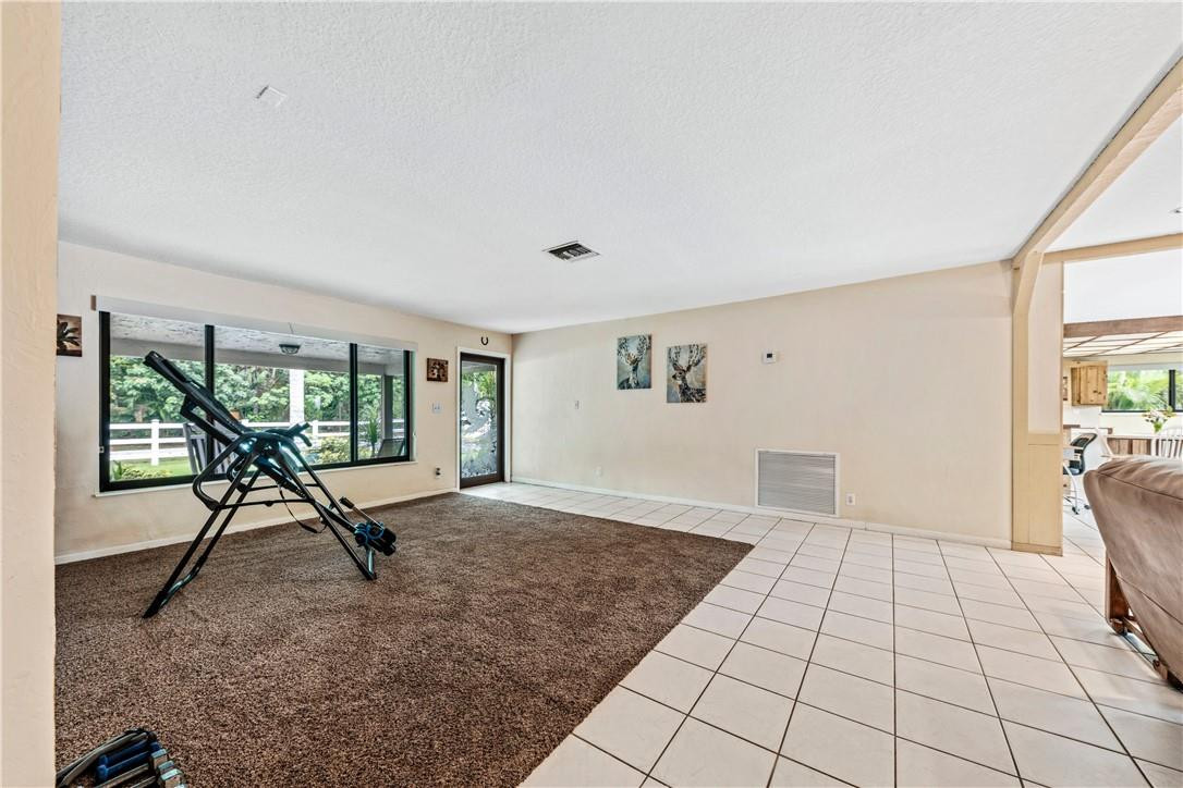 11301 Southwest 16th Street Davie, FL 33325 - Photo 15 of 54 a view of a room with furniture and a window