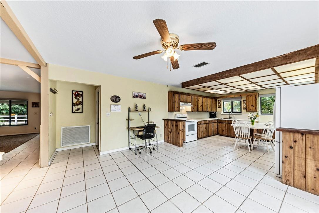 11301 Southwest 16th Street Davie, FL 33325 - Photo 17 of 54 a view of a livingroom with furniture and a ceiling fan