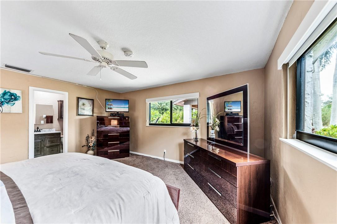 11301 Southwest 16th Street Davie, FL 33325 - Photo 22 of 54 a bedroom with a bed dresser and a large window