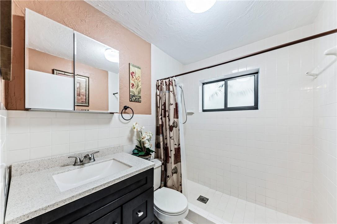 11301 Southwest 16th Street Davie, FL 33325 - Photo 24 of 54 a bathroom with a sink a toilet and shower
