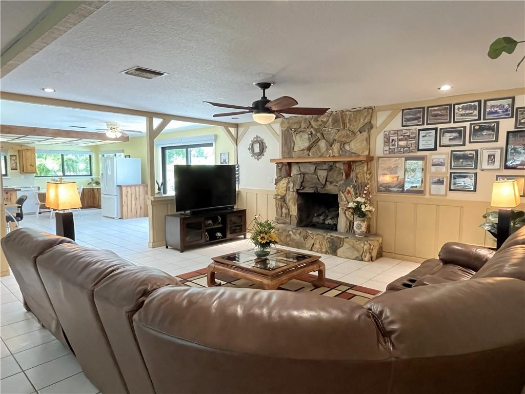 11301 Southwest 16th Street Davie, FL 33325 - Photo 29 of 54 a living room with fireplace furniture and a flat screen tv