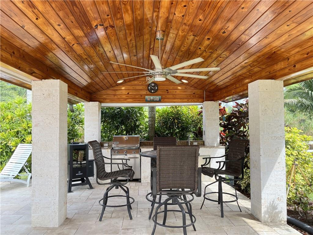 11301 Southwest 16th Street Davie, FL 33325 - Photo 4 of 54 a patio with yard glass top table and chairs