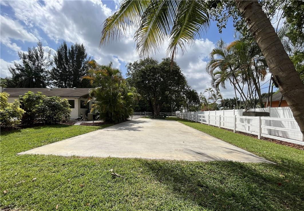 11301 Southwest 16th Street Davie, FL 33325 - Photo 46 of 54 a view of yard with swimming pool and green space