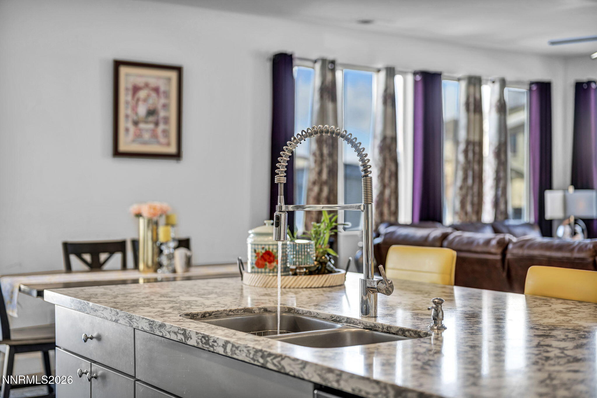 969 Estuary Circle Reno, NV 89506 - Photo 11 of 38 a kitchen with a granite counter top a stove and a sink