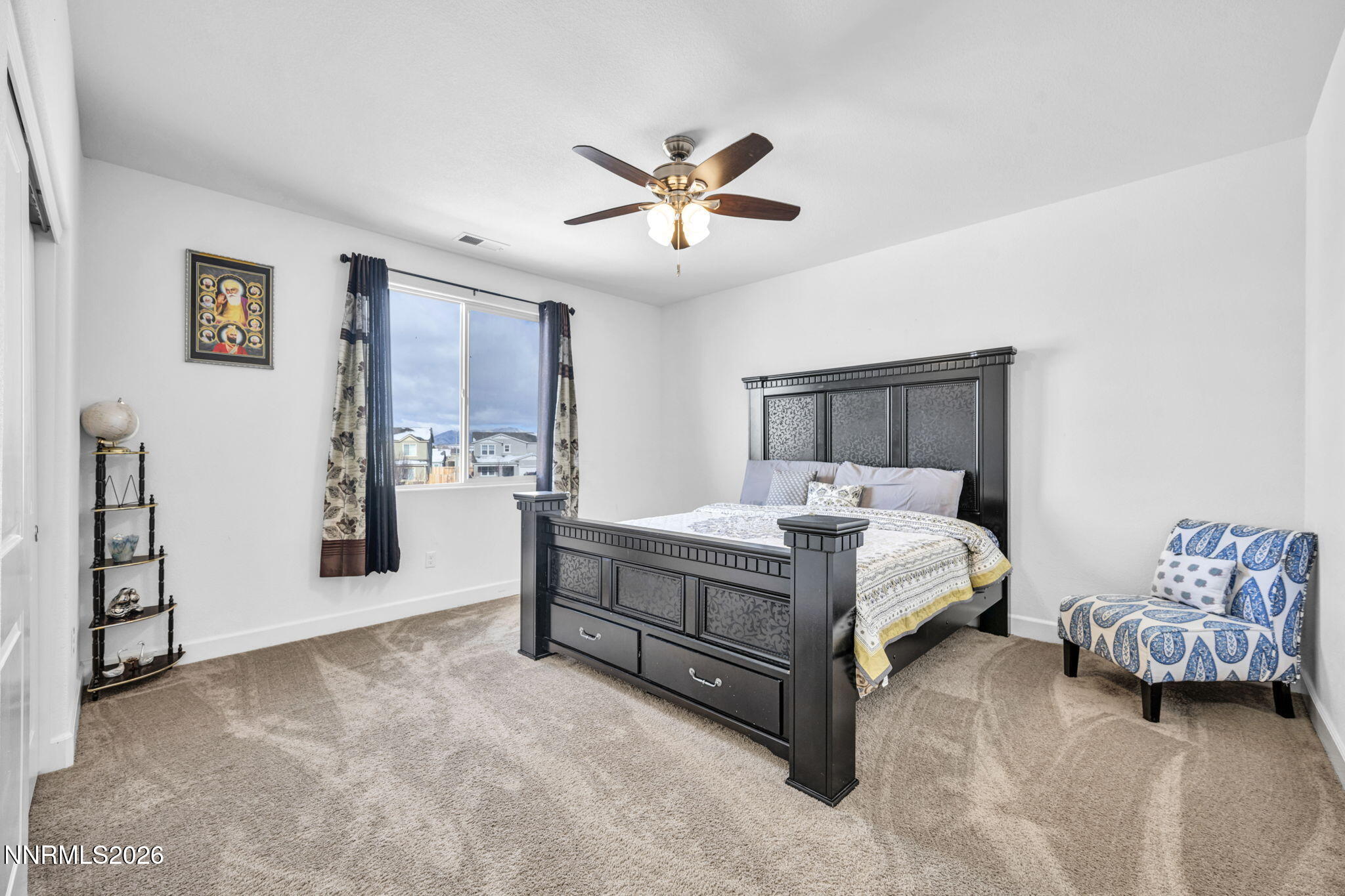 969 Estuary Circle Reno, NV 89506 - Photo 19 of 38 a bed room with a bed and a ceiling fan