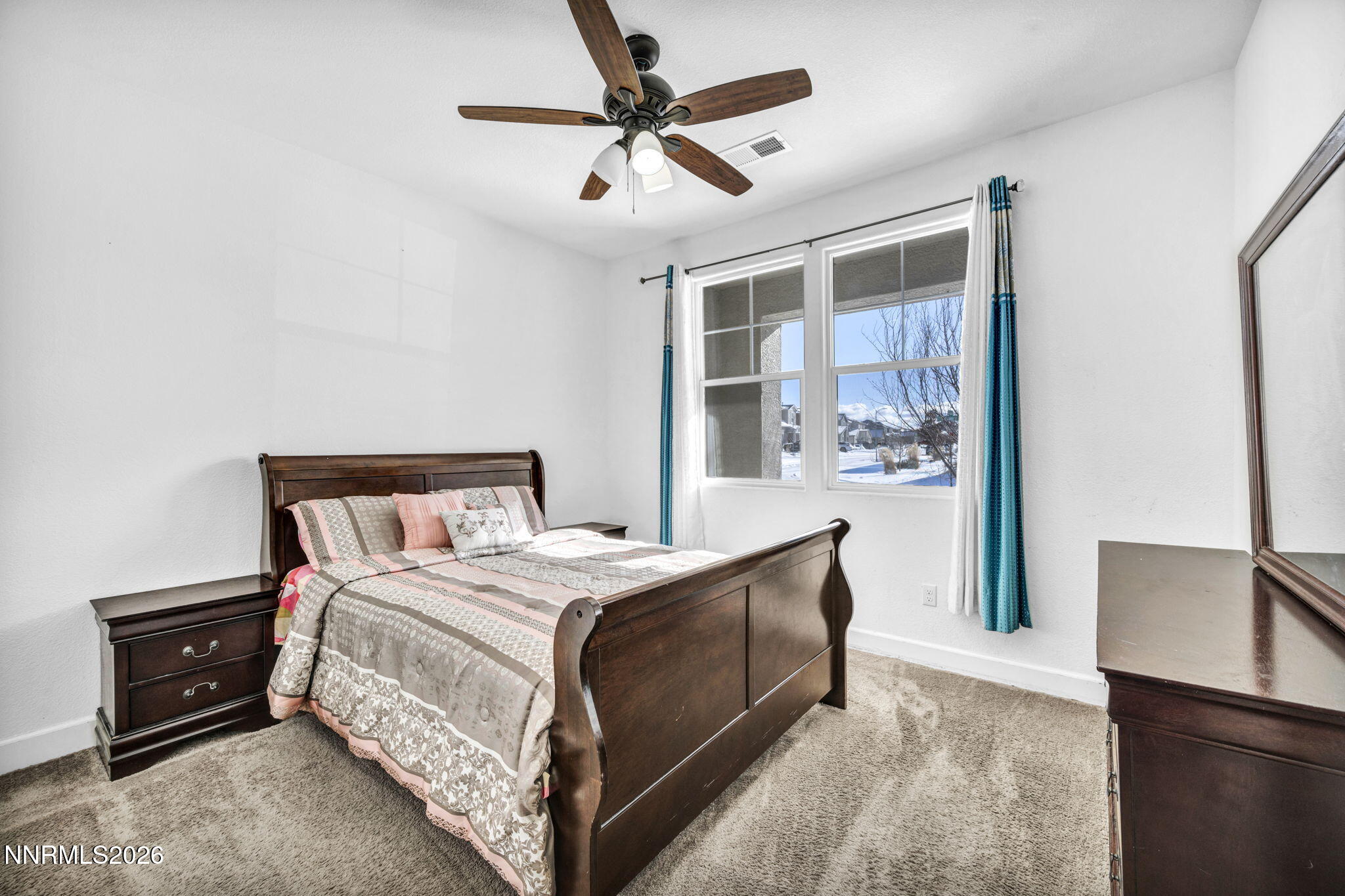 969 Estuary Circle Reno, NV 89506 - Photo 23 of 38 a bedroom with a bed and a ceiling fan