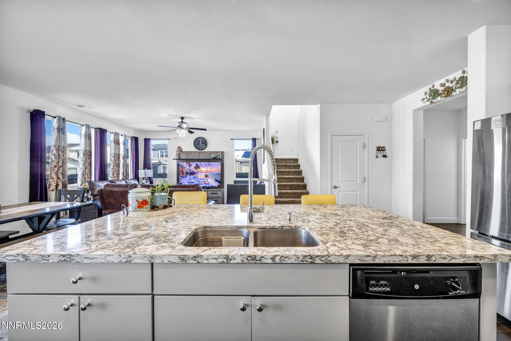 969 Estuary Circle Reno, NV 89506 - Photo 10 of 38 a kitchen with granite countertop a sink and a wooden floor