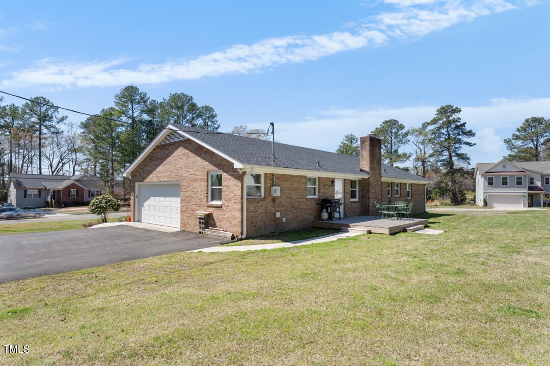 916 Clayton Road Durham, NC 27703 - Photo 25 of 32 a view of a house with backyard and sitting area