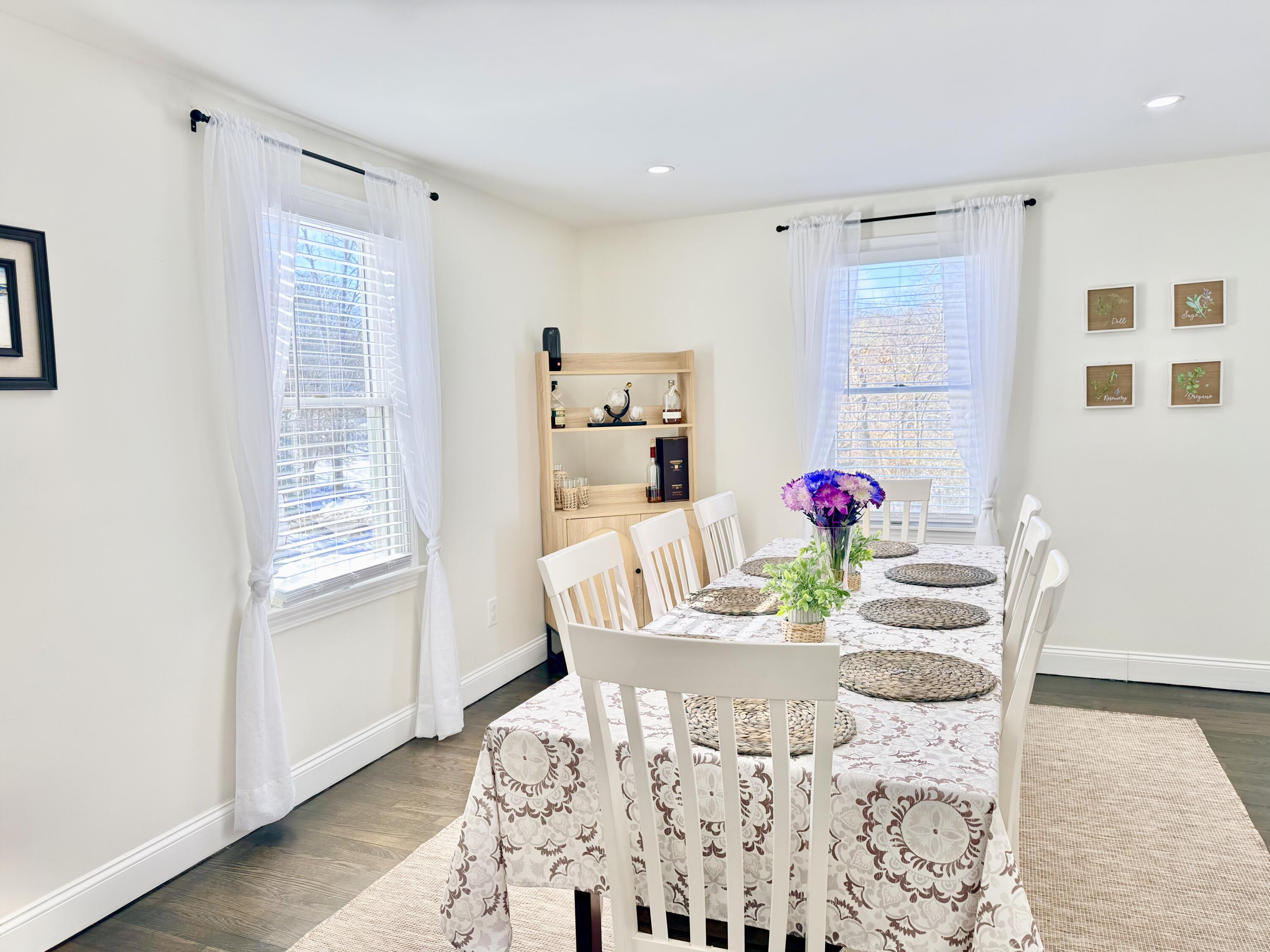 117 A P Newcomb Road Brewster, MA 02631 - Photo 13 of 69 a view of a dining room with furniture and wooden floor