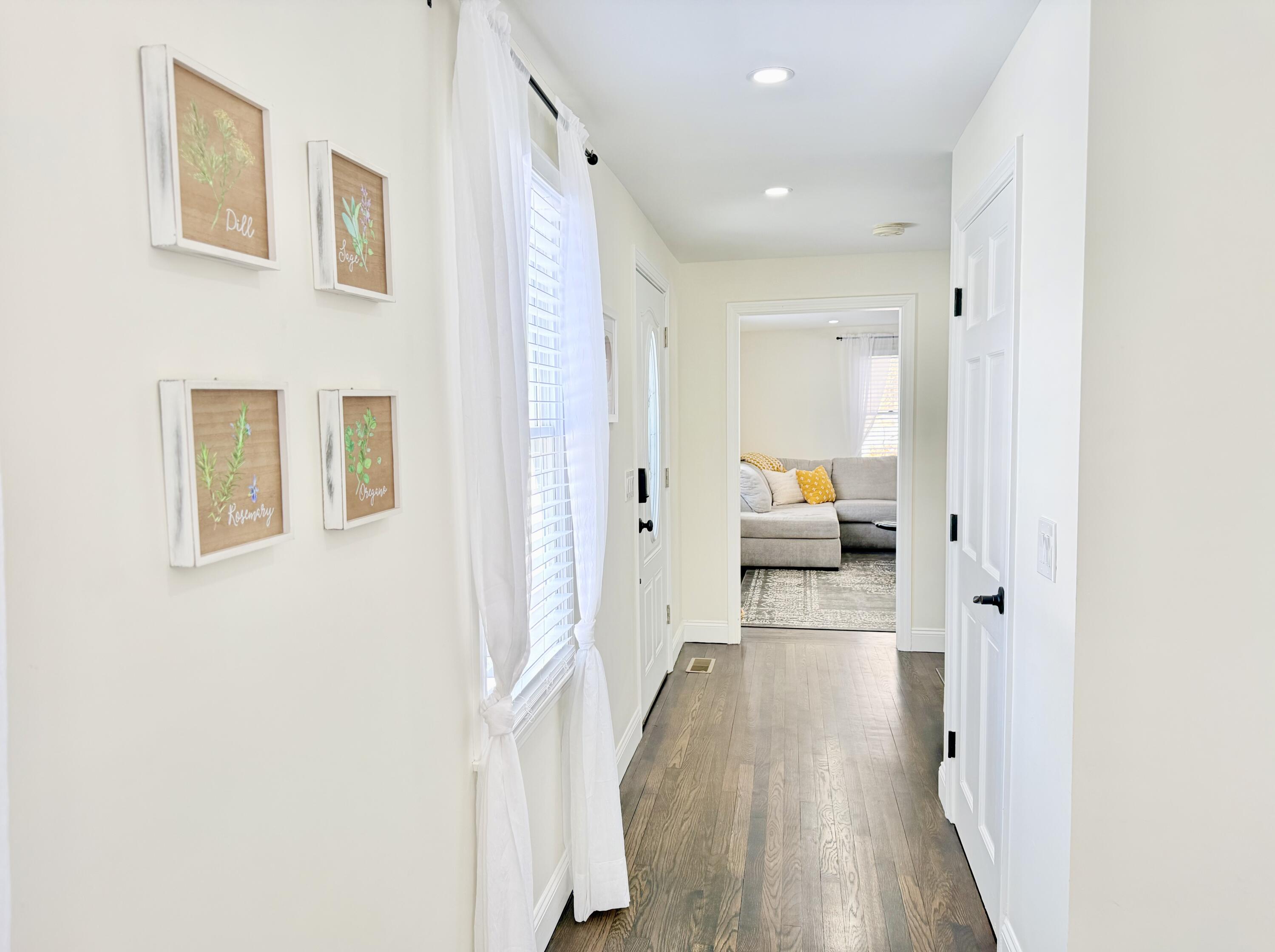 117 A P Newcomb Road Brewster, MA 02631 - Photo 14 of 69 a view of a hallway with wooden floor and furniture