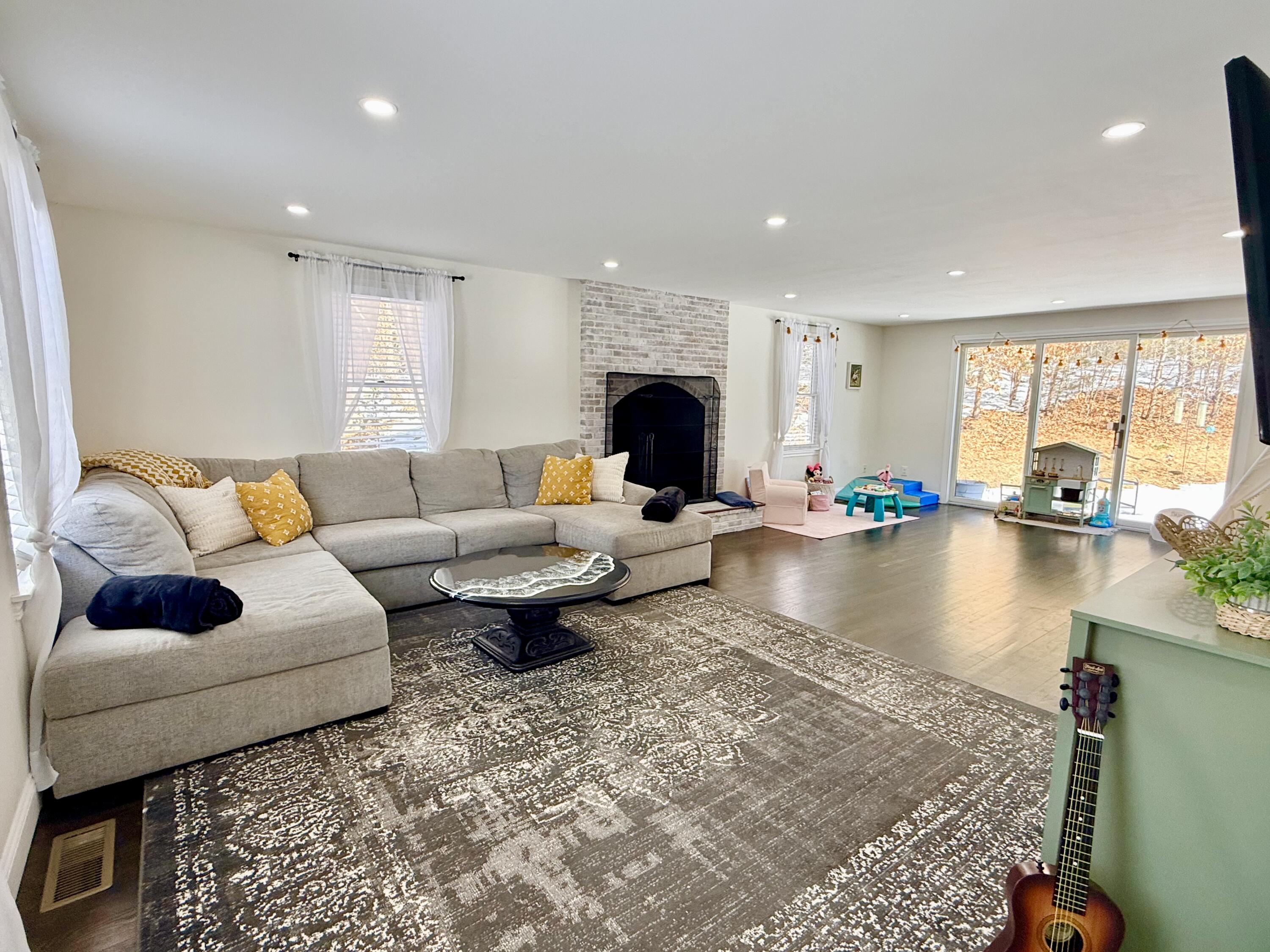 117 A P Newcomb Road Brewster, MA 02631 - Photo 16 of 69 a living room with furniture and a large window