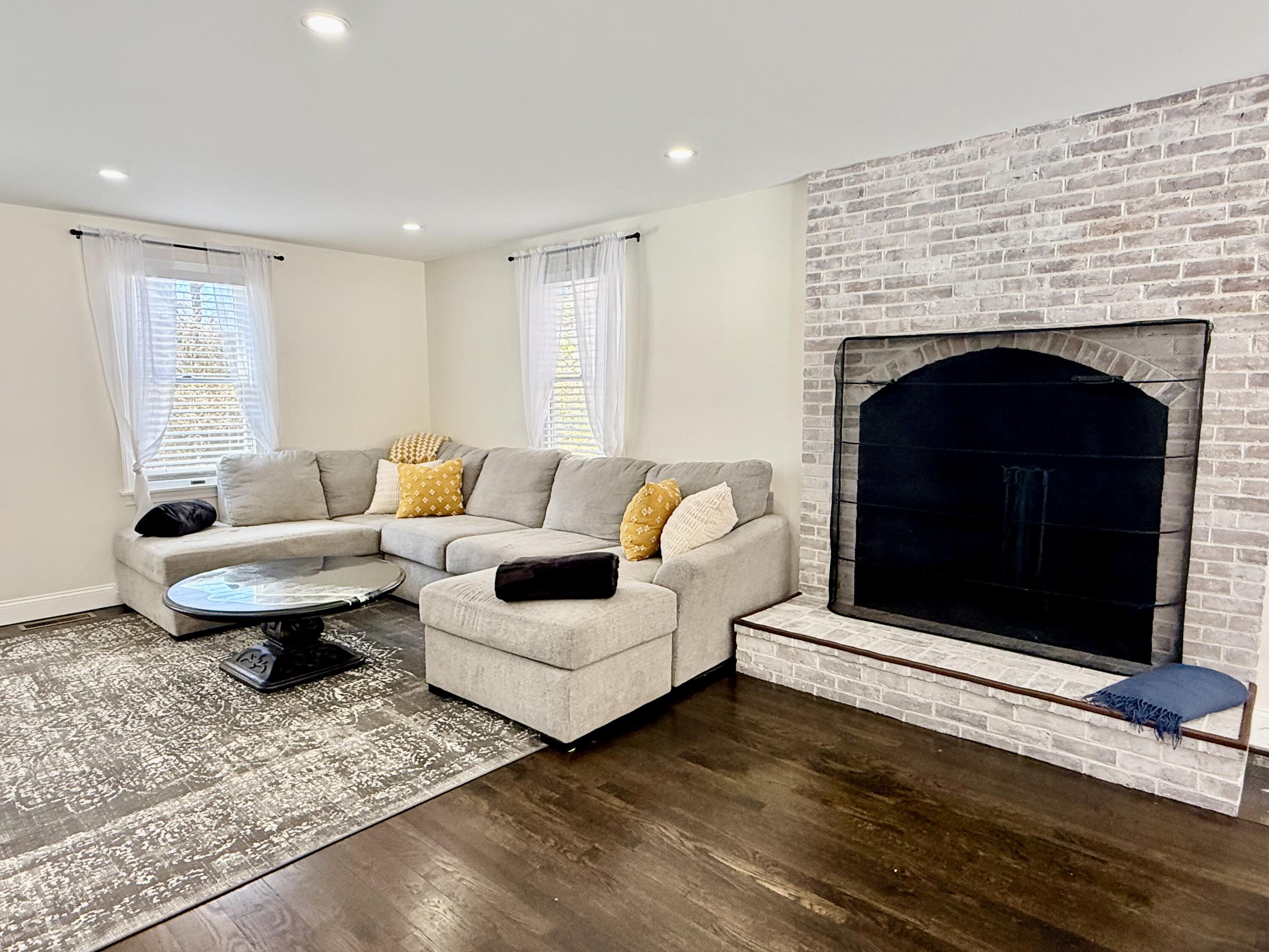 117 A P Newcomb Road Brewster, MA 02631 - Photo 19 of 69 a living room with furniture and a fireplace