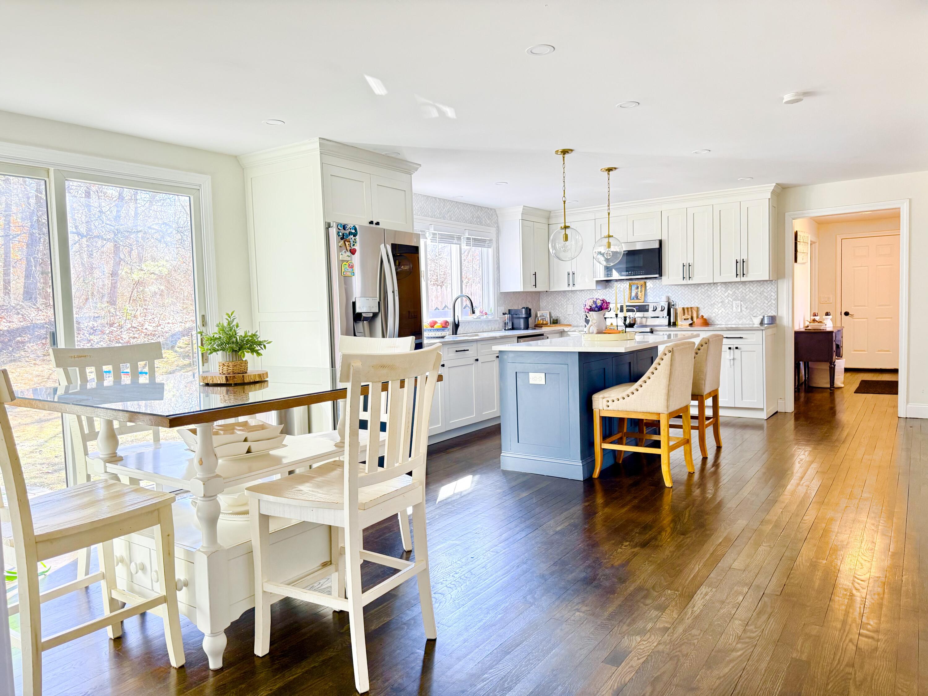 117 A P Newcomb Road Brewster, MA 02631 - Photo 20 of 69 a view of a dining room with furniture and wooden floor