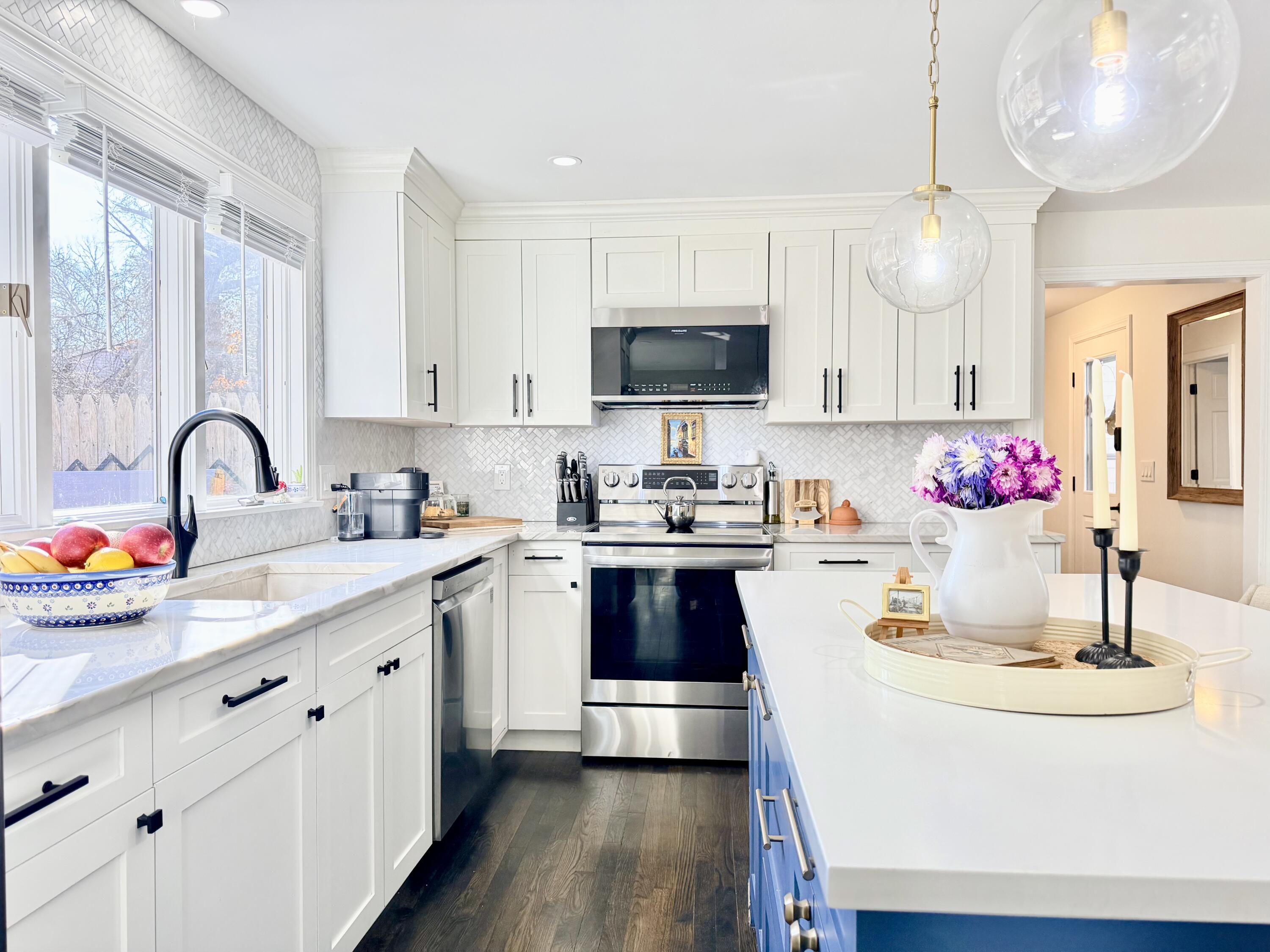 117 A P Newcomb Road Brewster, MA 02631 - Photo 21 of 69 a kitchen with kitchen island granite countertop a sink stainless steel appliances and cabinets