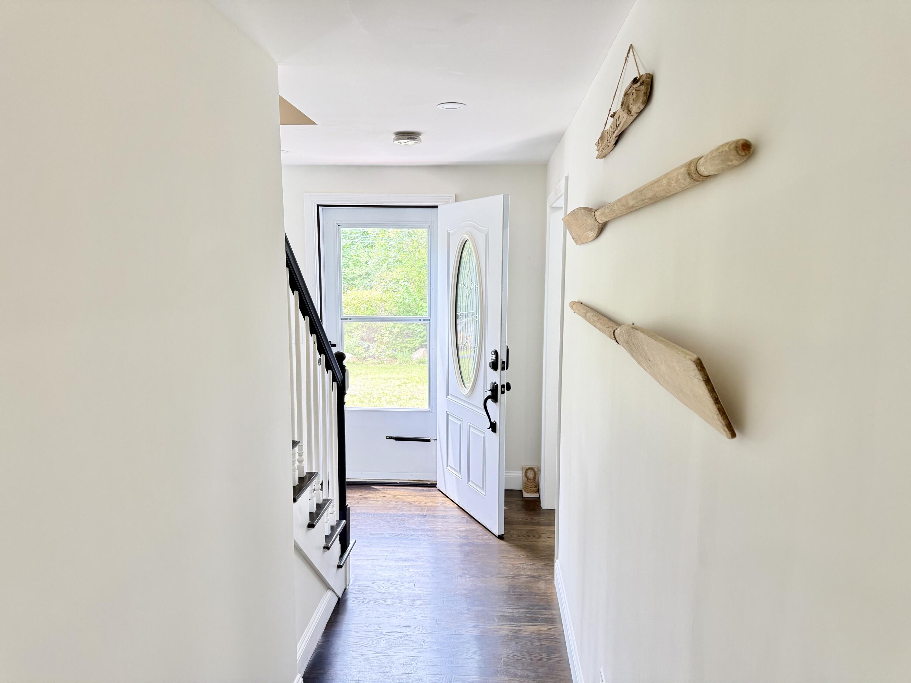 117 A P Newcomb Road Brewster, MA 02631 - Photo 25 of 69 a view of a hallway with wooden floor and entryway