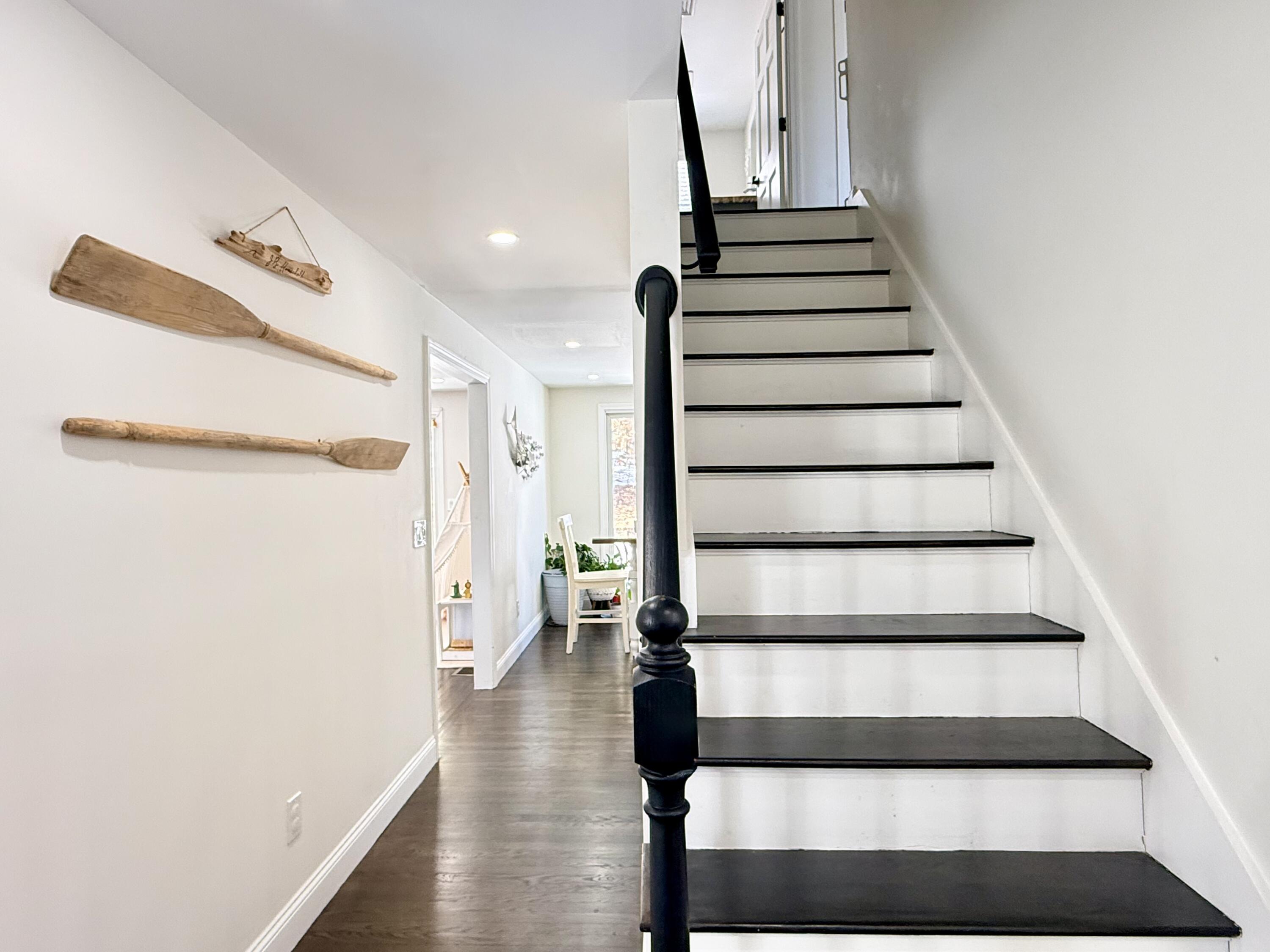 117 A P Newcomb Road Brewster, MA 02631 - Photo 26 of 69 a view of entryway with wooden floor and stairs