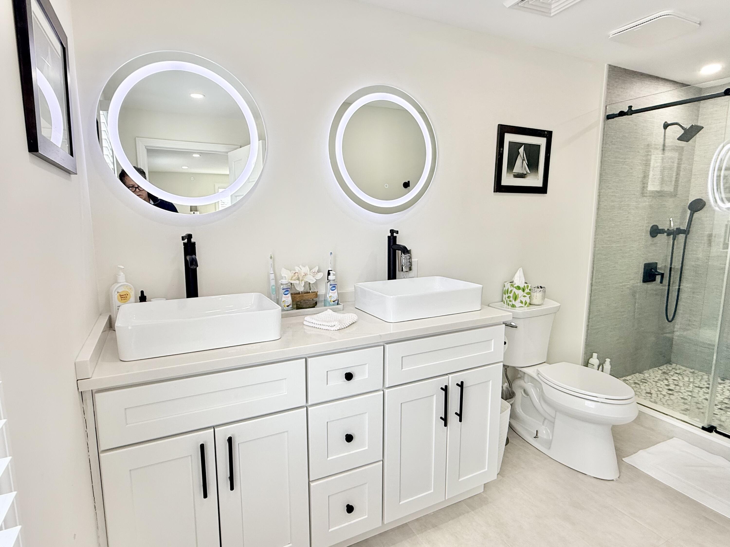 117 A P Newcomb Road Brewster, MA 02631 - Photo 29 of 69 a bathroom with 2 sink and a mirror