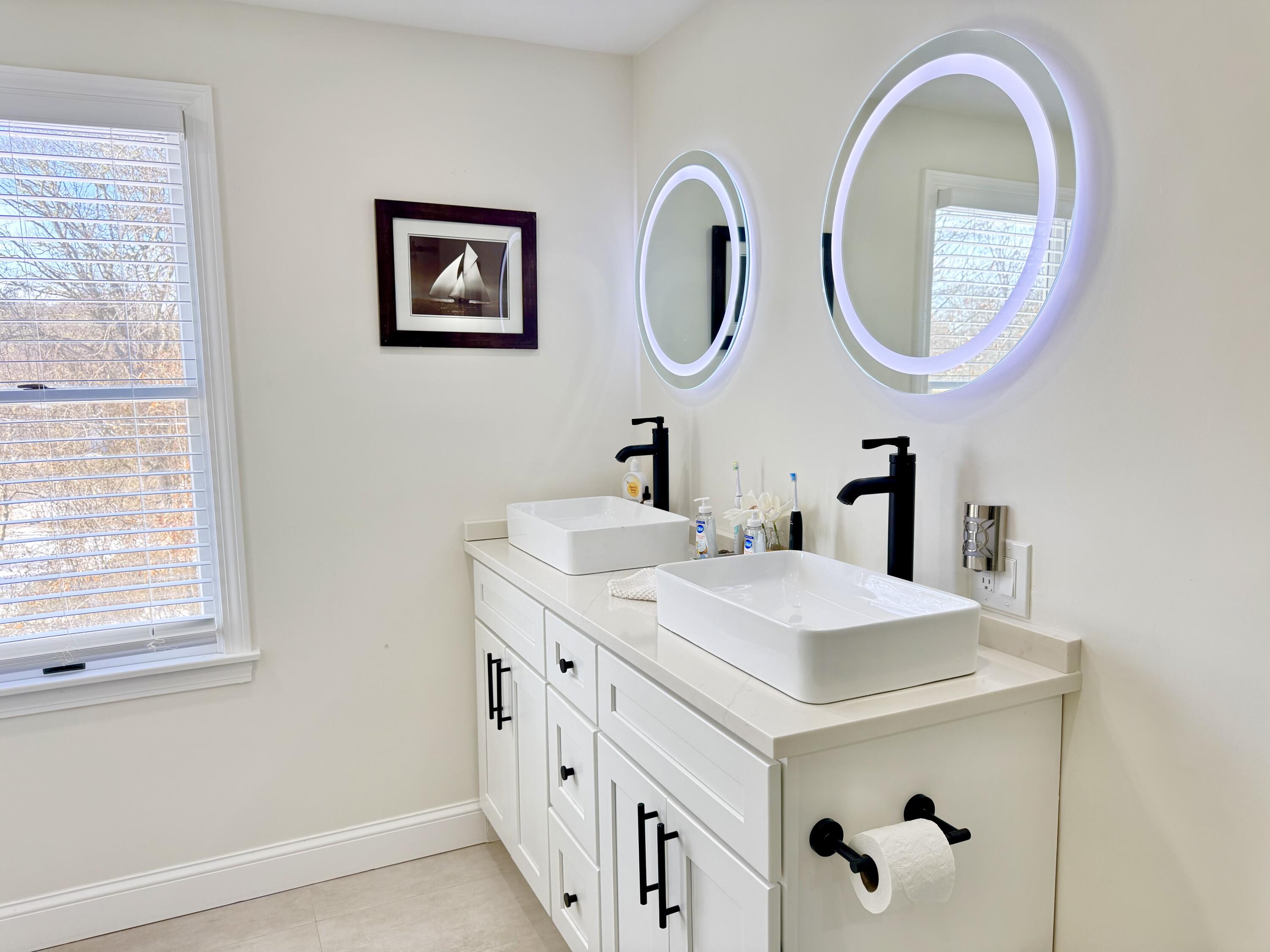 117 A P Newcomb Road Brewster, MA 02631 - Photo 31 of 69 a bathroom with a sink and a mirror
