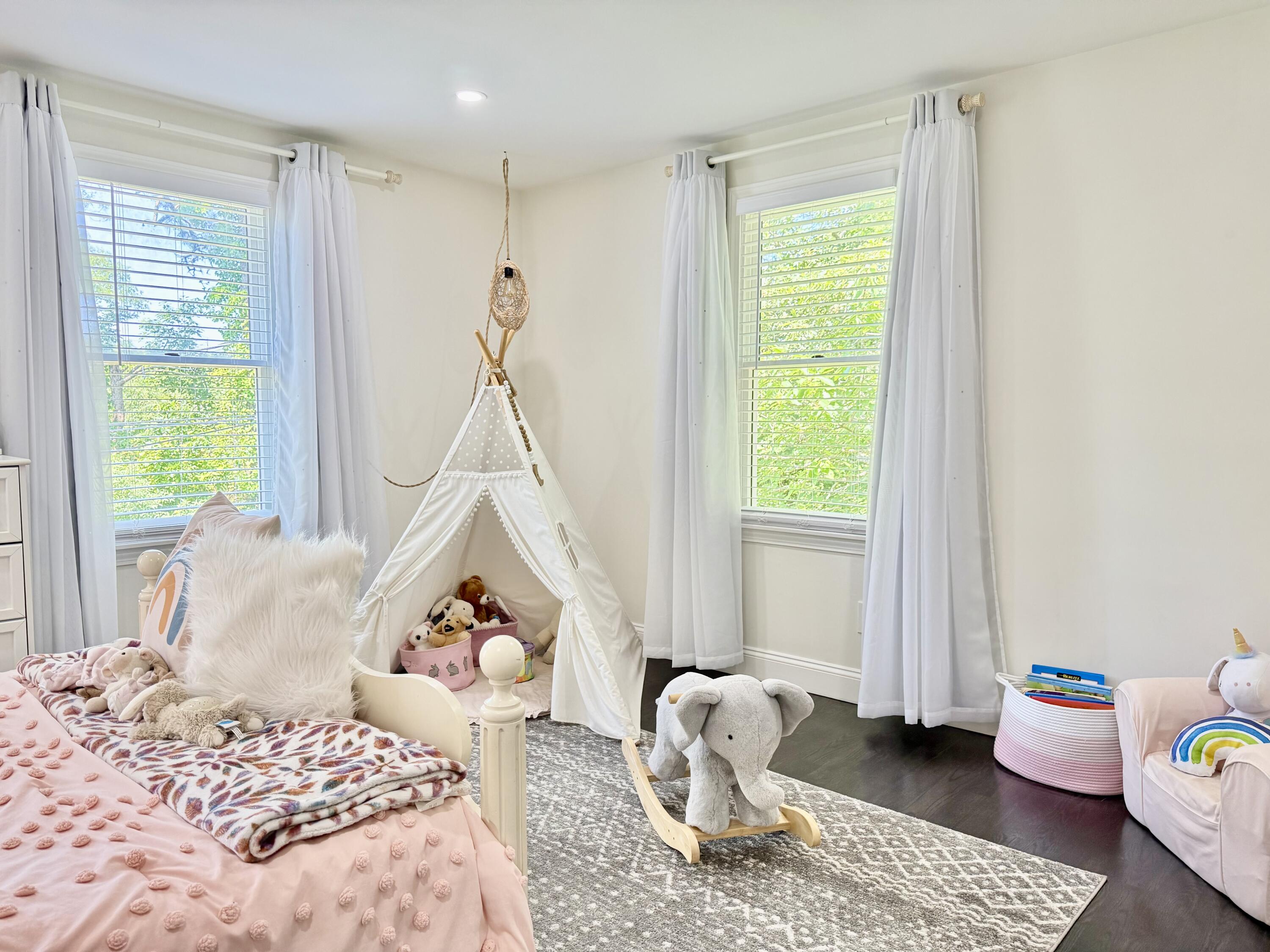 117 A P Newcomb Road Brewster, MA 02631 - Photo 39 of 69 a bedroom with a bed and wooden floor