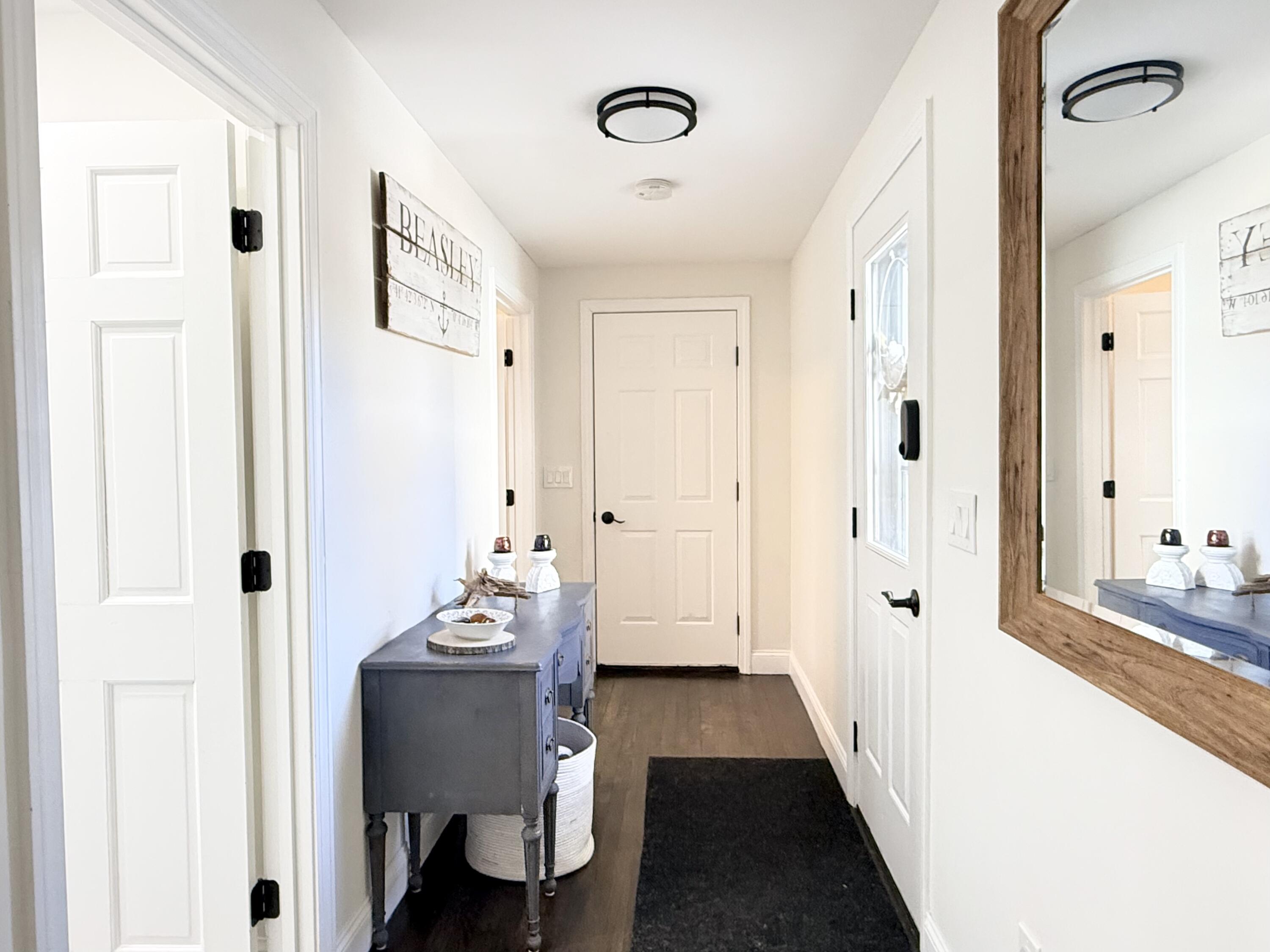 117 A P Newcomb Road Brewster, MA 02631 - Photo 43 of 69 a view of a hallway with a livingroom and furniture