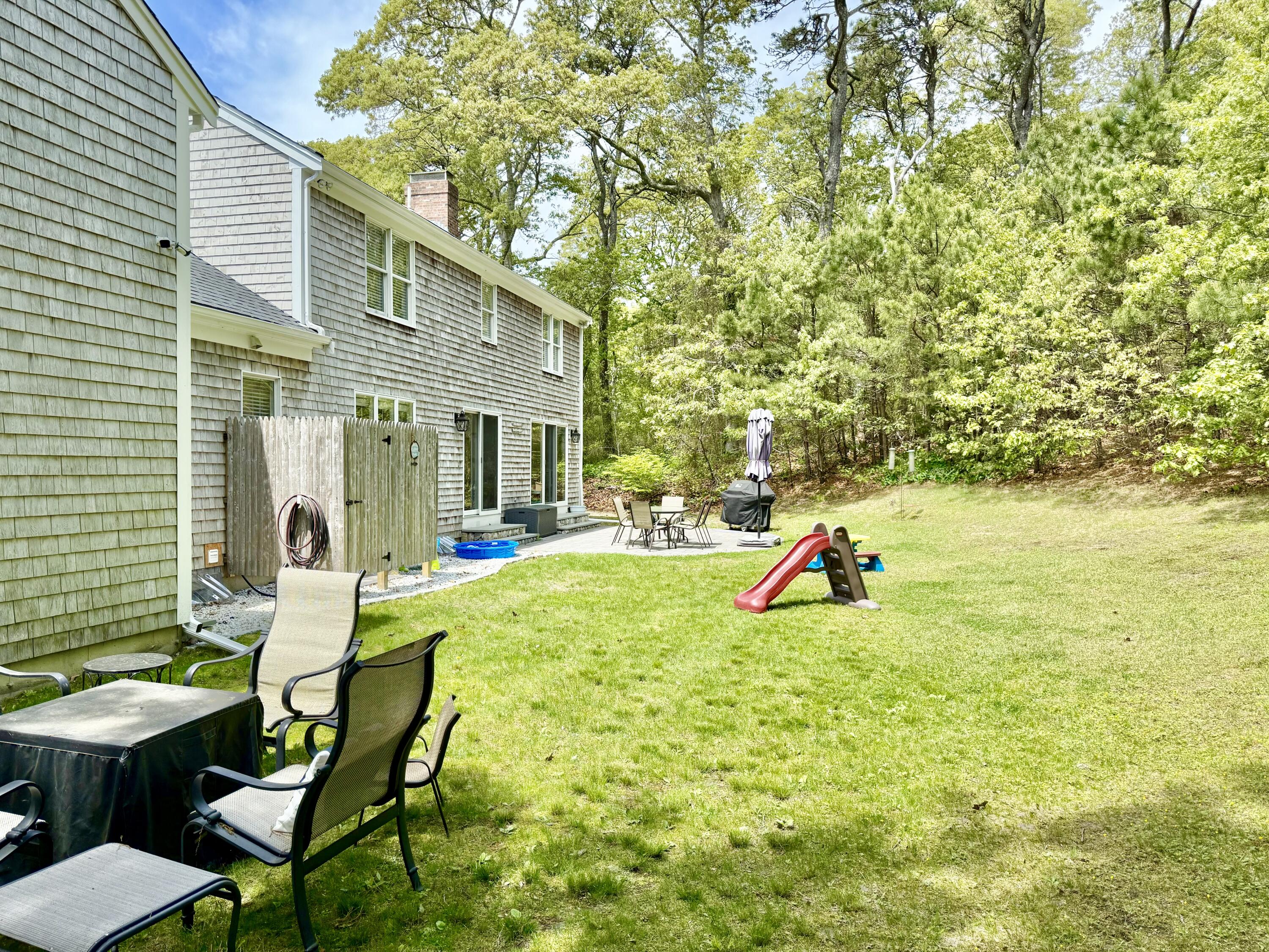 117 A P Newcomb Road Brewster, MA 02631 - Photo 58 of 69 a view of a house with backyard and sitting area