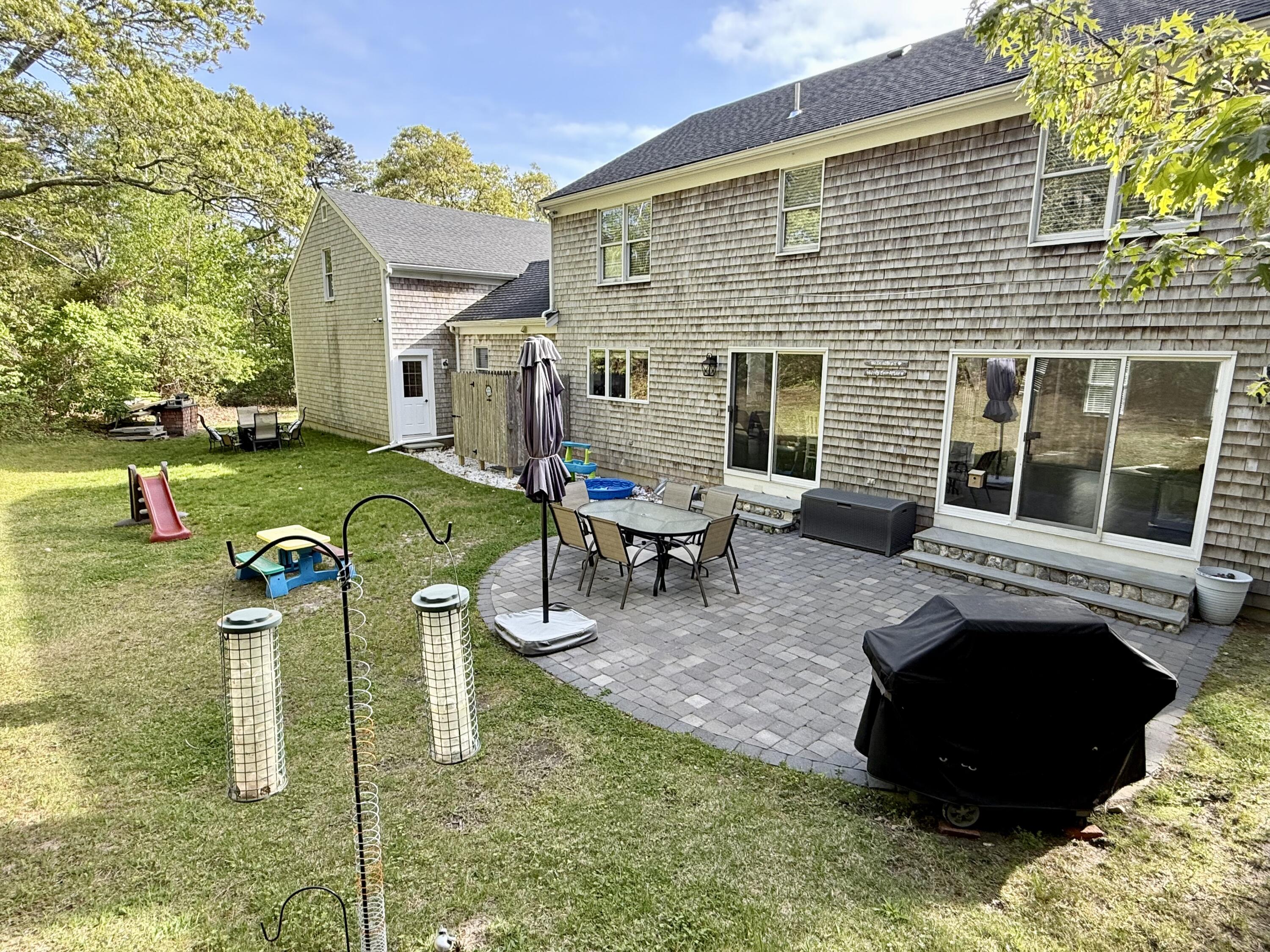 117 A P Newcomb Road Brewster, MA 02631 - Photo 60 of 69 a view of a house with backyard porch and sitting area