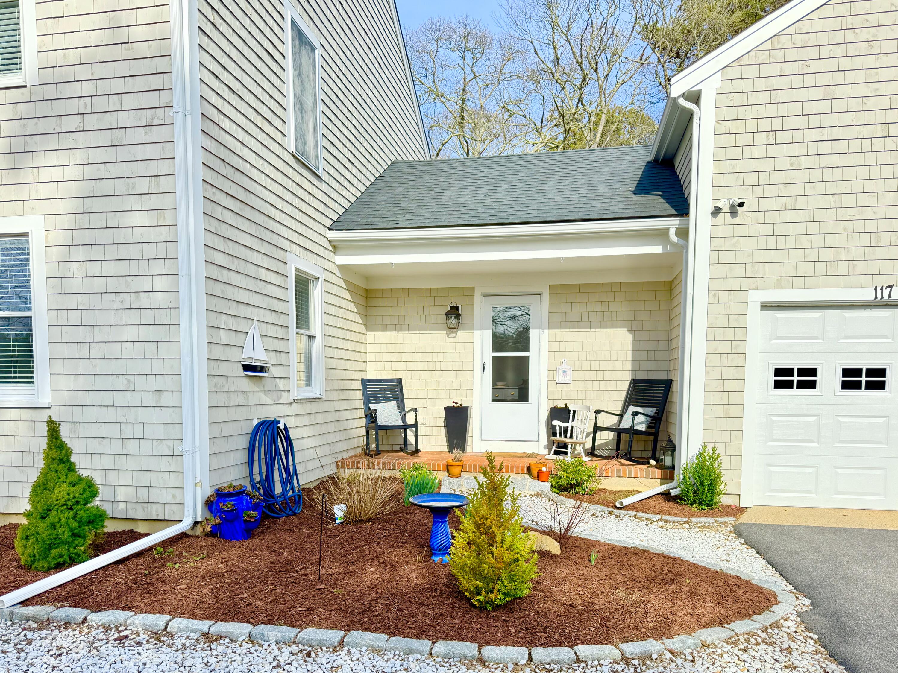 117 A P Newcomb Road Brewster, MA 02631 - Photo 8 of 69 a front view of a house with a yard