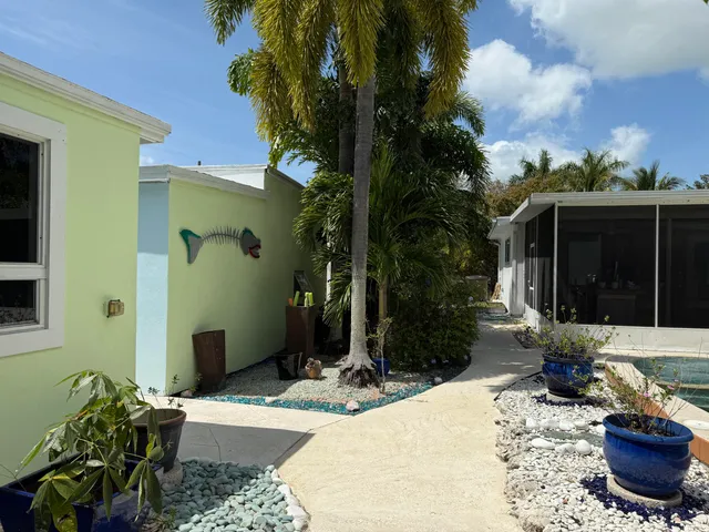 a living room with furniture and a book shelf