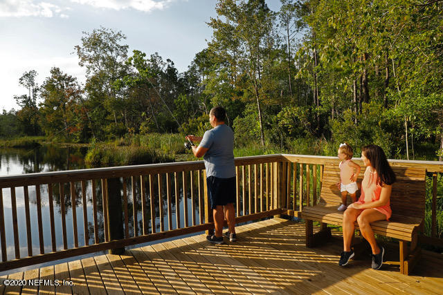 594 Buttonwood Loop Yulee, FL 32097 - Photo 27 of 39 041_Family Fishing on Dock_KMcCray