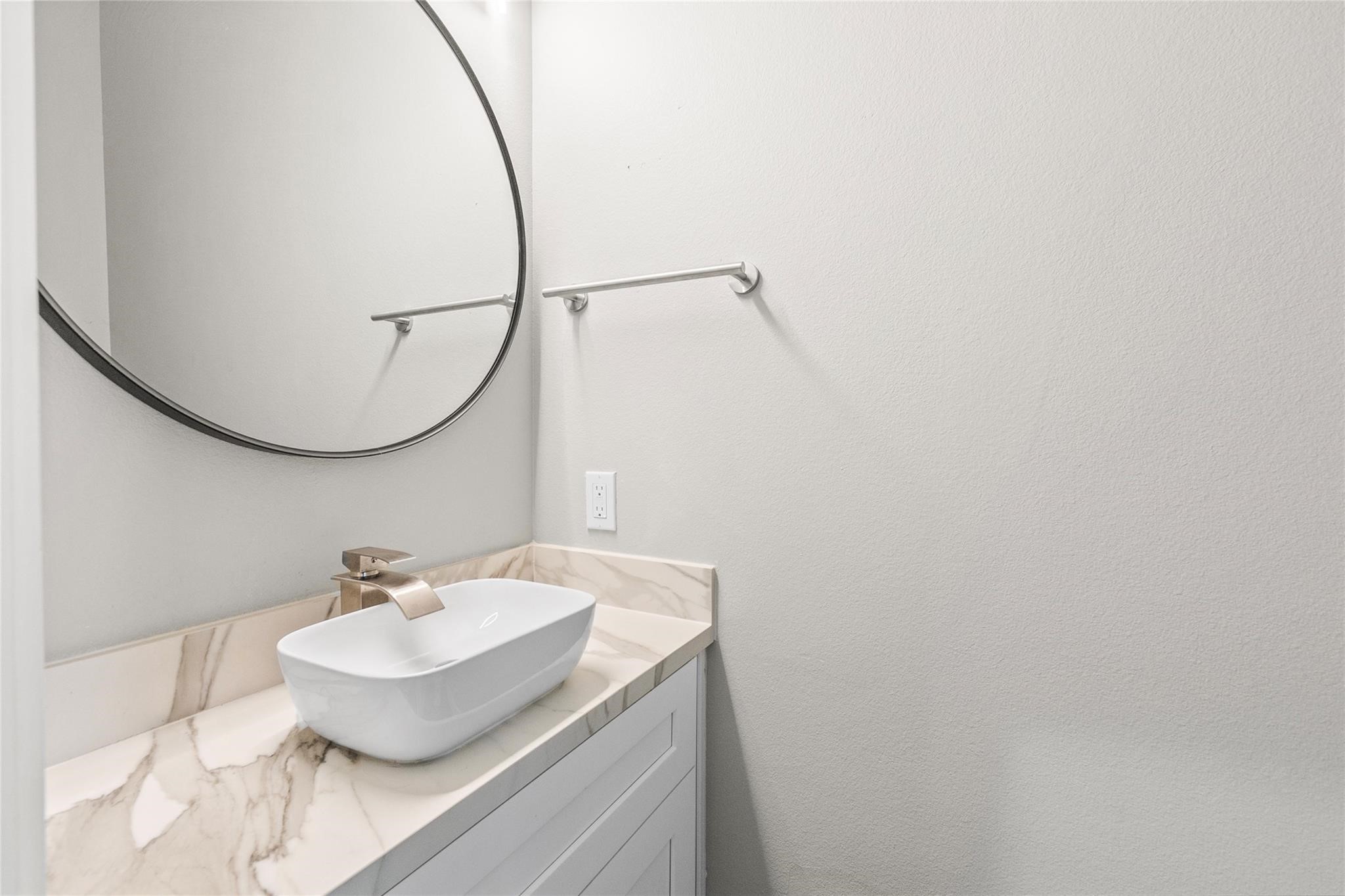 5506 Pershing Street Houston, TX 77033 - Photo 24 of 29 a bathroom with a sink and a mirror
