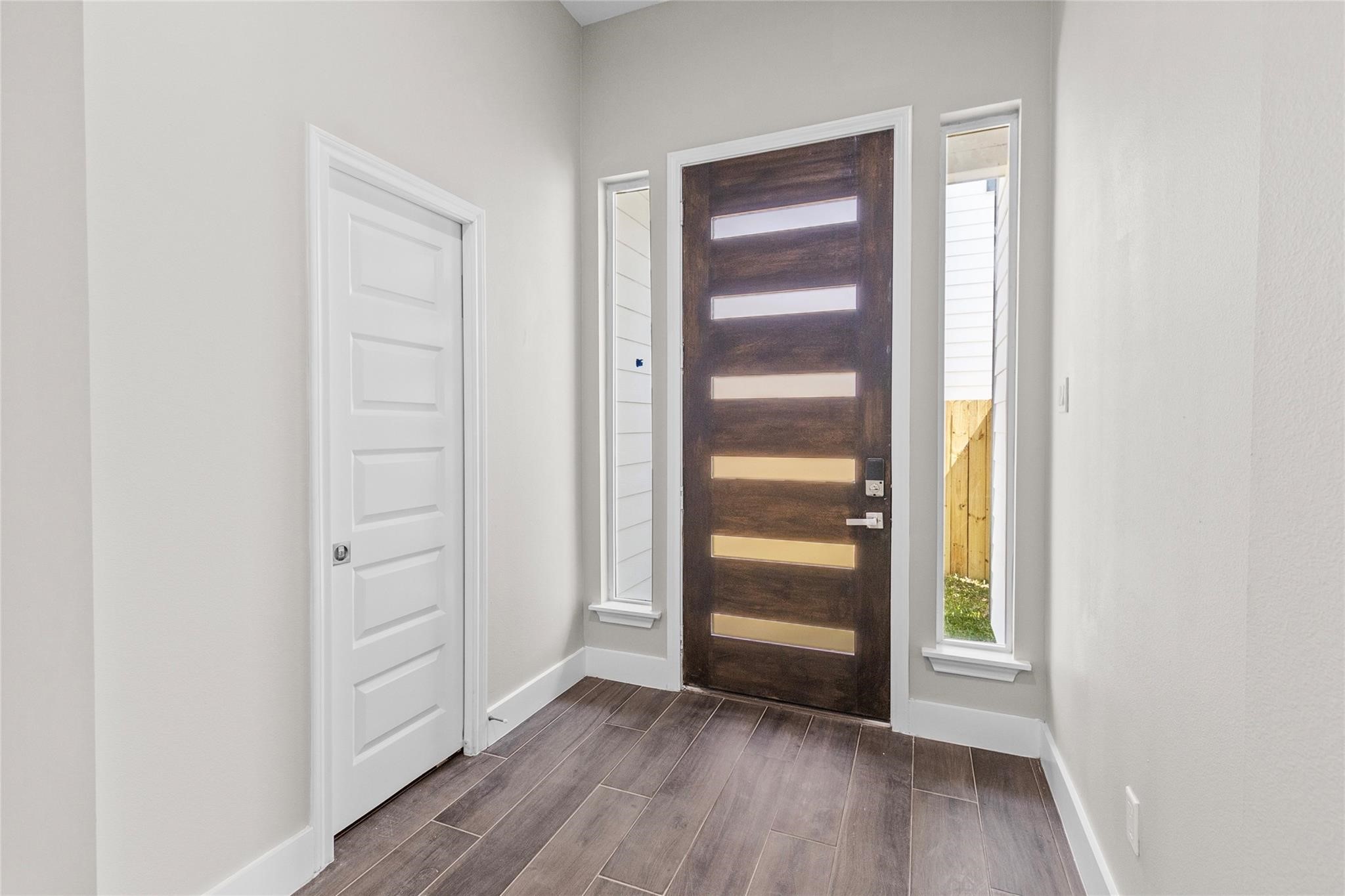 5506 Pershing Street Houston, TX 77033 - Photo 4 of 29 a view of a hallway with wooden floor
