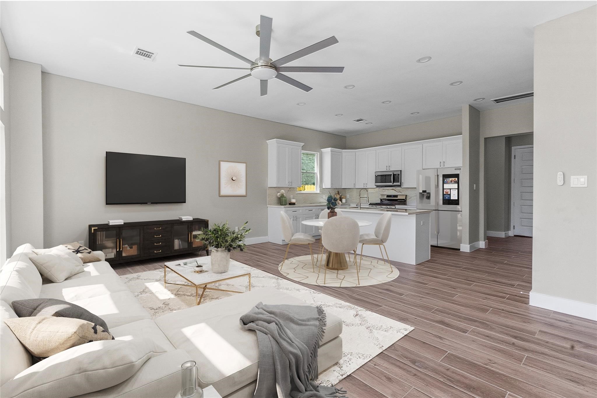 5506 Pershing Street Houston, TX 77033 - Photo 6 of 29 a living room with furniture kitchen view and a wooden floor