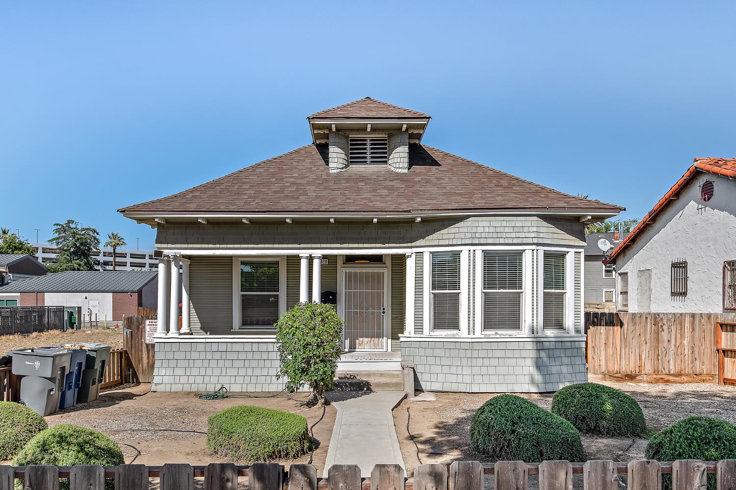 1320 P Street Fresno, CA 93721 - Photo 1 of 12 a front view of a house with yard and porch